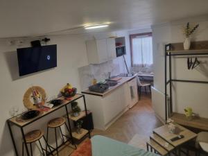 a kitchen with a sink and a counter top at Platinum cottage in Villeneuve d'Ascq