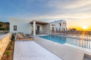 a villa with a swimming pool and a house at Casa Tierra - Villa II in Kos
