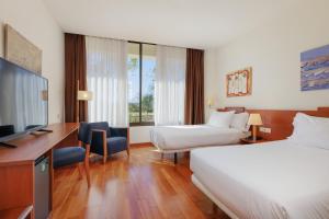Posteľ alebo postele v izbe v ubytovaní Sercotel Arrahona Sabadell