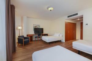 Posteľ alebo postele v izbe v ubytovaní Sercotel Arrahona Sabadell