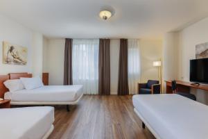 Posteľ alebo postele v izbe v ubytovaní Sercotel Arrahona Sabadell