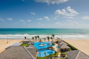 an aerial view of a resort on the beach at The Coral Beach Resort in Trairi +7 photos