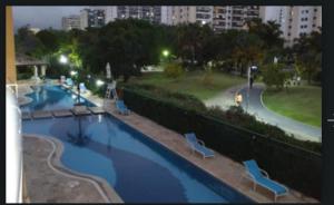 a view of a swimming pool in a park at night at Bela Vista in Rio de Janeiro