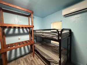 a bedroom with two bunk beds in a room at OQP Vacations in Miami