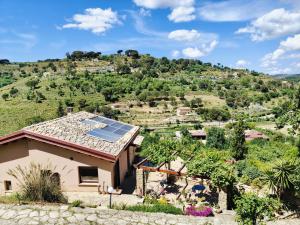 a house with solar panels on the roof at Panorama Suite in Piazza Armerina