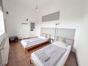 Posteľ alebo postele v izbe v ubytovaní Artist Guest House
