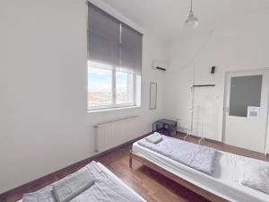 Posteľ alebo postele v izbe v ubytovaní Artist Guest House