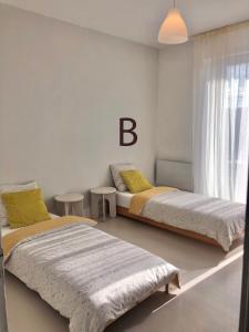 Katil atau katil-katil dalam bilik di Fleur de coton - 7 lits
