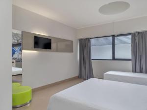 Postel nebo postele na pokoji v ubytování B&B Hotel Como Camerlata