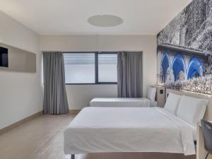 Postel nebo postele na pokoji v ubytování B&B Hotel Como Camerlata