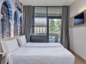 Postel nebo postele na pokoji v ubytování B&B Hotel Como Camerlata