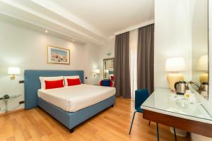Postel nebo postele na pokoji v ubytování Hotel Royal Torino Centro Congressi