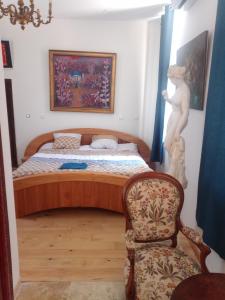 Postel nebo postele na pokoji v ubytování La Suite Diane du couvent des Capucines avec climatisation