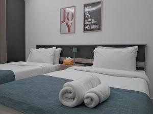 Letto o letti in una camera di Shade Suites & Studios