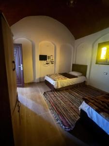 Ένα ή περισσότερα κρεβάτια σε δωμάτιο στο Marina Siwa House