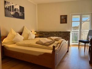 Postel nebo postele na pokoji v ubytování Ferienwohnung Zur Scheune