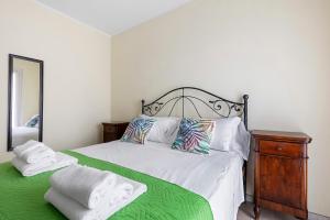 En eller flere senge i et værelse på Apt Amè Peschiera del Garda