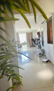 a living room with a large tile floor at Couple's Getaway in Is-Swieqi