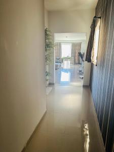a hallway of a house with a living room at Couple's Getaway in Is-Swieqi