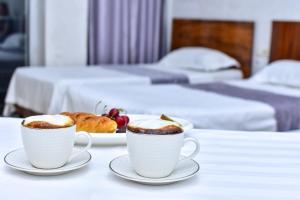 Postel nebo postele na pokoji v ubytování Hotel Chveni Sakhli
