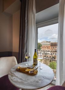 Nápoje v ubytovaní Torre Argentina Relais - Residenze di Charme