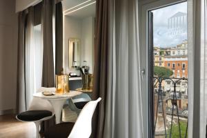 Posedenie v ubytovaní Torre Argentina Relais - Residenze di Charme