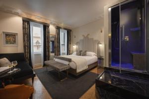 Posteľ alebo postele v izbe v ubytovaní Torre Argentina Relais - Residenze di Charme