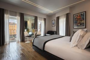 Posteľ alebo postele v izbe v ubytovaní Torre Argentina Relais - Residenze di Charme