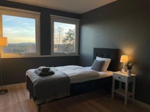 Postel nebo postele na pokoji v ubytování ÁILU - Arctic Hotel Apartments