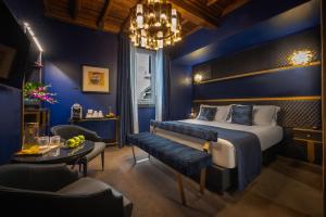Posteľ alebo postele v izbe v ubytovaní Torre Argentina Relais - Residenze di Charme