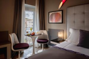 Posteľ alebo postele v izbe v ubytovaní Torre Argentina Relais - Residenze di Charme