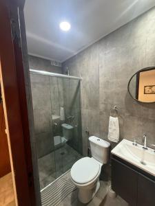 a bathroom with a toilet and a shower and a sink at Emperatriz I in Posadas