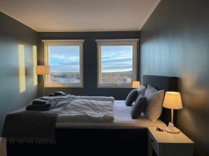 Postel nebo postele na pokoji v ubytování ÁILU - Arctic Hotel Apartments
