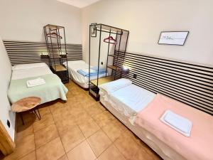 a room with two beds and a mirror at Pensión San Pedro in Viana +53 photos