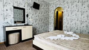 Postel nebo postele na pokoji v ubytování Hotel Eos