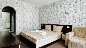 Postel nebo postele na pokoji v ubytování Hotel Eos