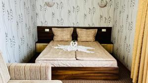 Postel nebo postele na pokoji v ubytování Hotel Eos