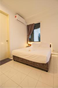 a bedroom with a large bed with a window at Downtown Condo KL City - 18 pax in Kuala Lumpur +38 photos