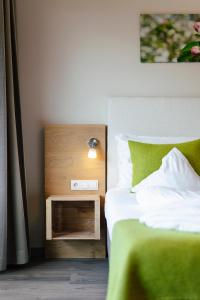 Postel nebo postele na pokoji v ubytování Hotel Pfeiss