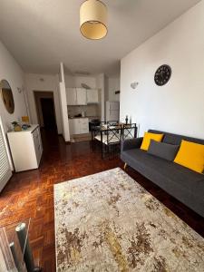 a living room with a couch and a table at América Apartment Holiday in Funchal