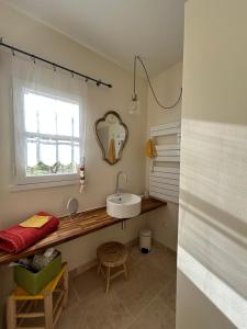 a bathroom with a sink and a mirror at Au Clair Ventoux B & B - SPA in Saint-Didier +103 photos
