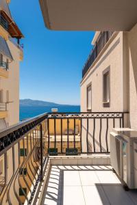 a balcony with a view of the ocean at Luxury Sea View Apartments in Sarandë