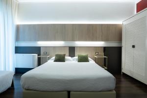 Postel nebo postele na pokoji v ubytování Hotel Italia
