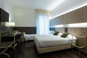 Postel nebo postele na pokoji v ubytování Hotel Italia