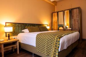 A bed or beds in a room at ATLAS OTELİ