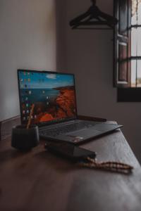 a laptop computer sitting on top of a table at Villa Bellido in Alora