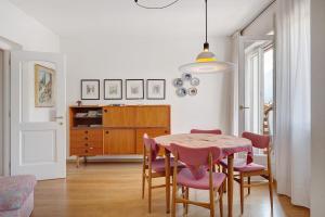 a dining room with a table and chairs at Casa Marta in Cavalese