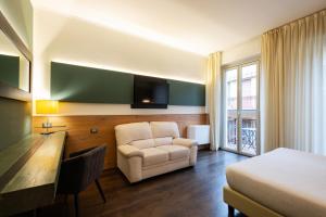 Postel nebo postele na pokoji v ubytování Hotel Italia