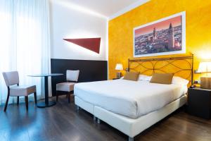 Postel nebo postele na pokoji v ubytování Hotel Italia