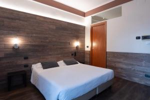 Postel nebo postele na pokoji v ubytování Hotel Italia